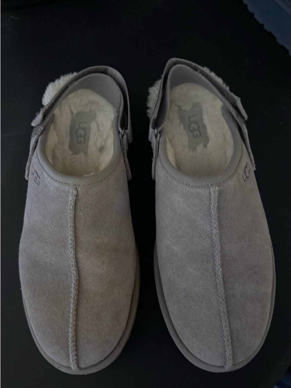UGG Suede platform Shearling Slip-On Clogs in light grey.